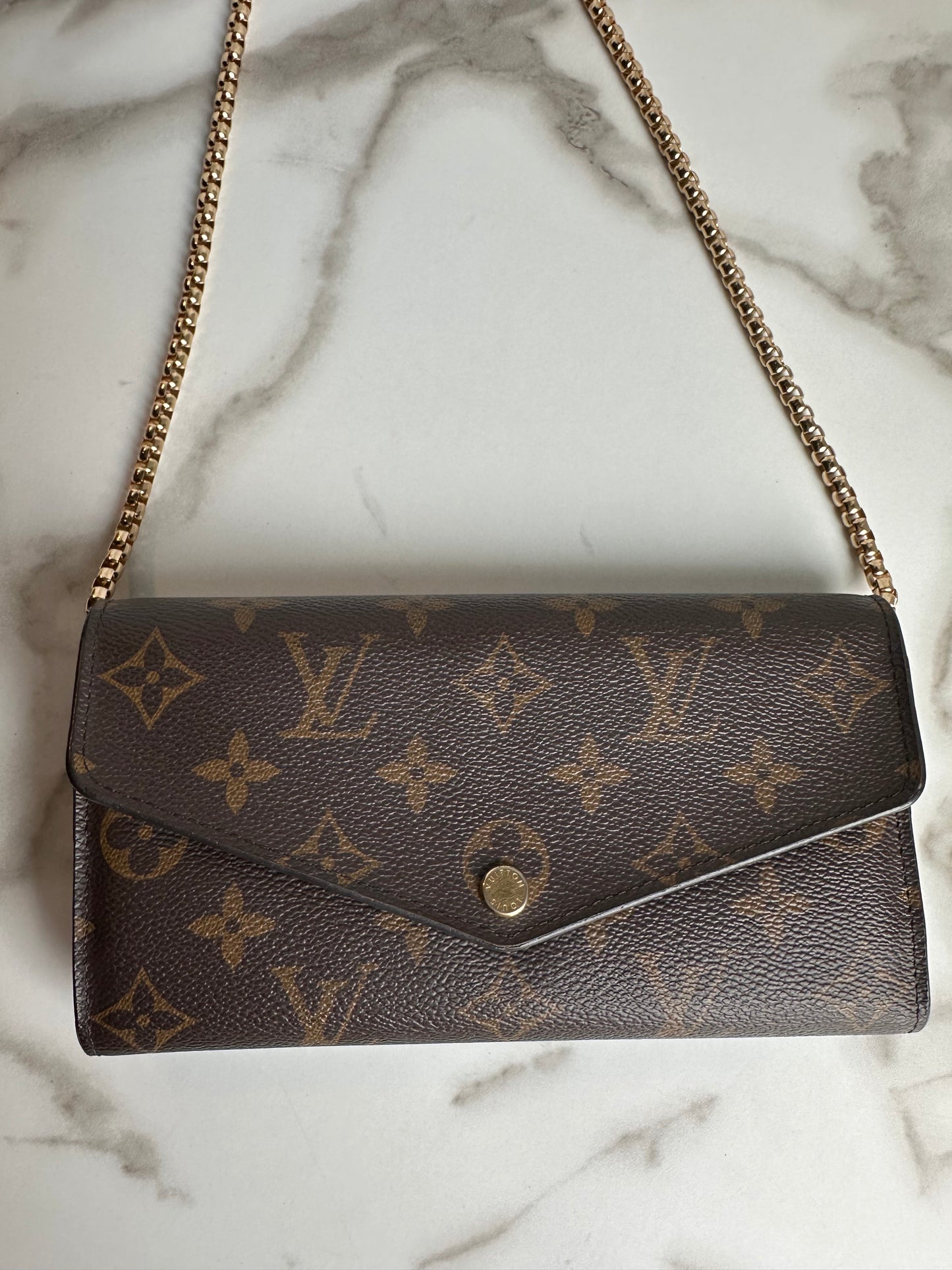 Available Louis Vuitton Sarah Wallet on chain