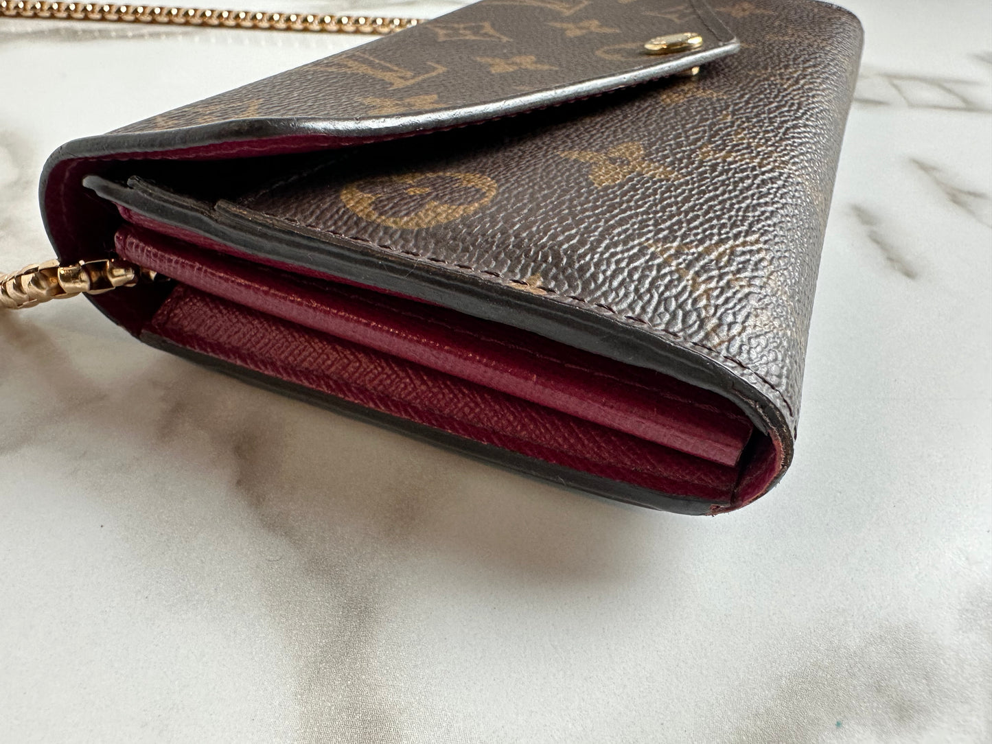 Available Louis Vuitton Sarah Wallet on chain