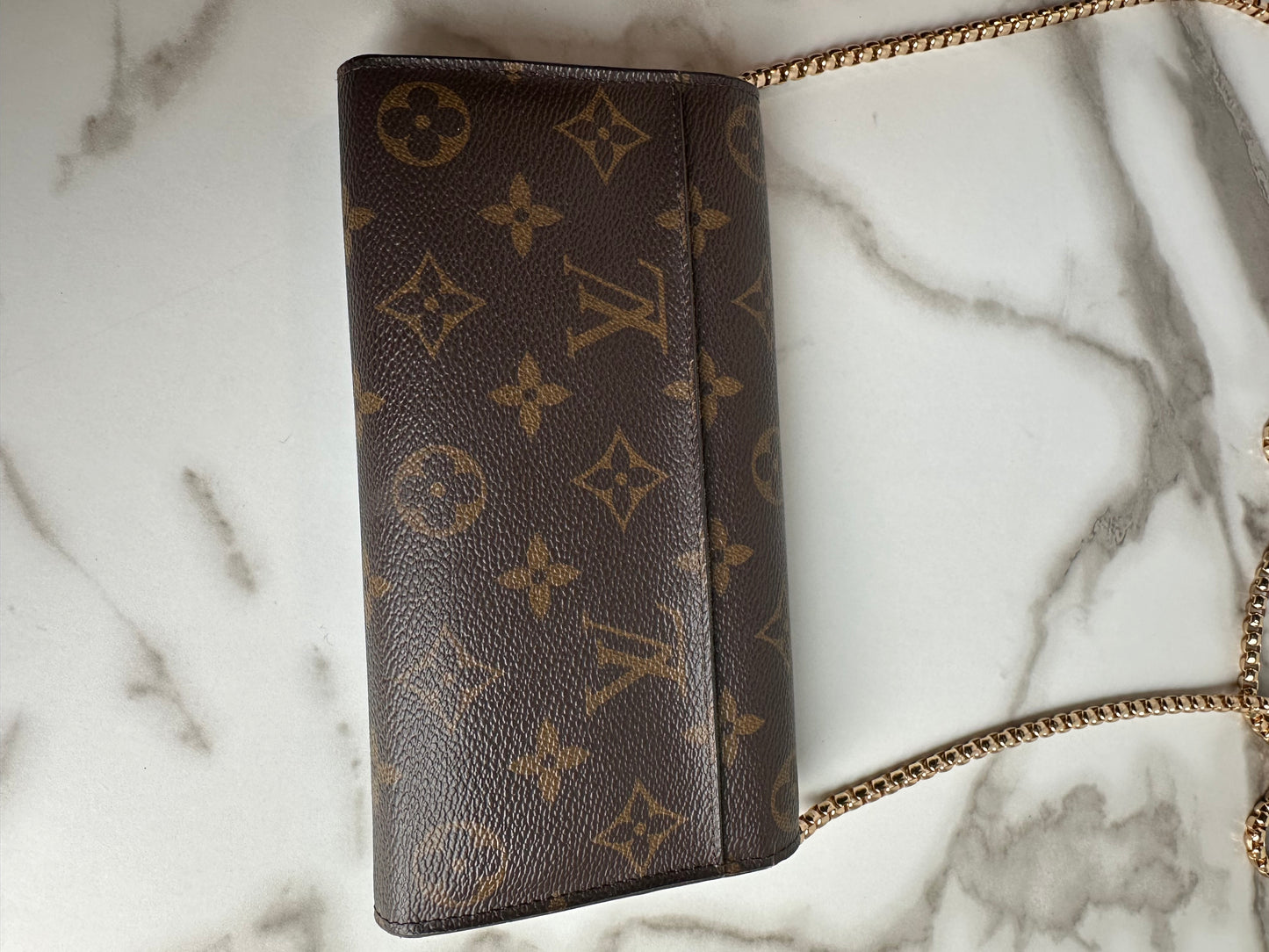 Available Louis Vuitton Sarah Wallet on chain