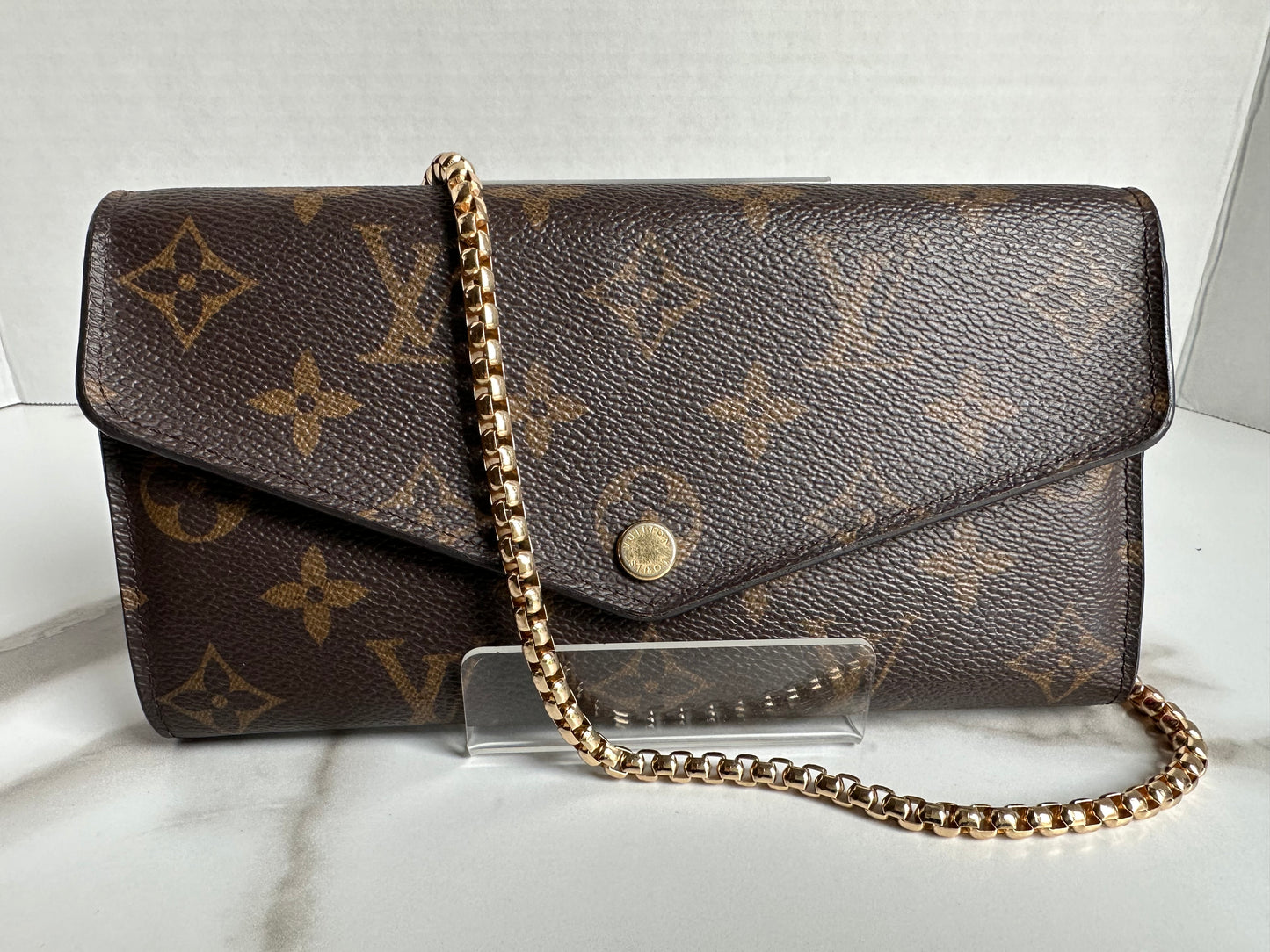Available Louis Vuitton Sarah Wallet on chain