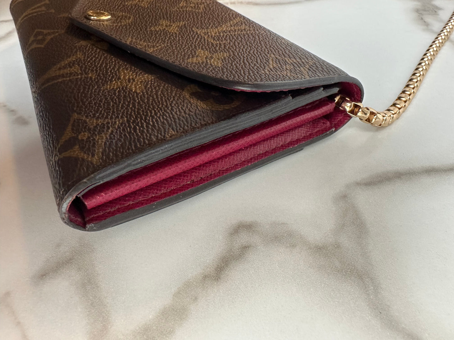 Available Louis Vuitton Sarah Wallet on chain
